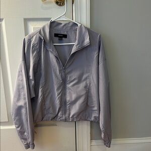 Forever 21 Purple/Gray Cropped Wind Breaker. It folds into a carrying bag.